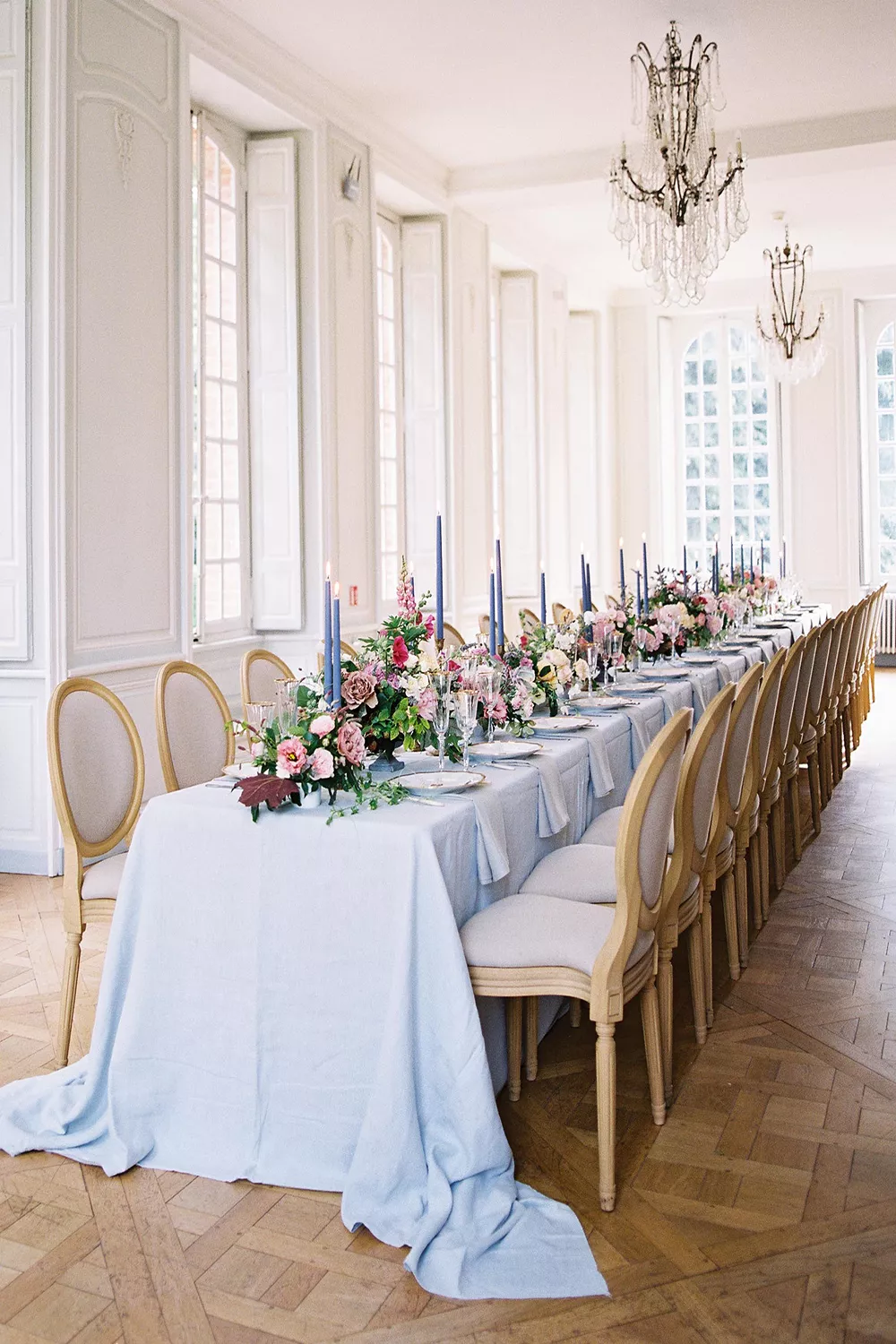Long reception table set with flowers and candles